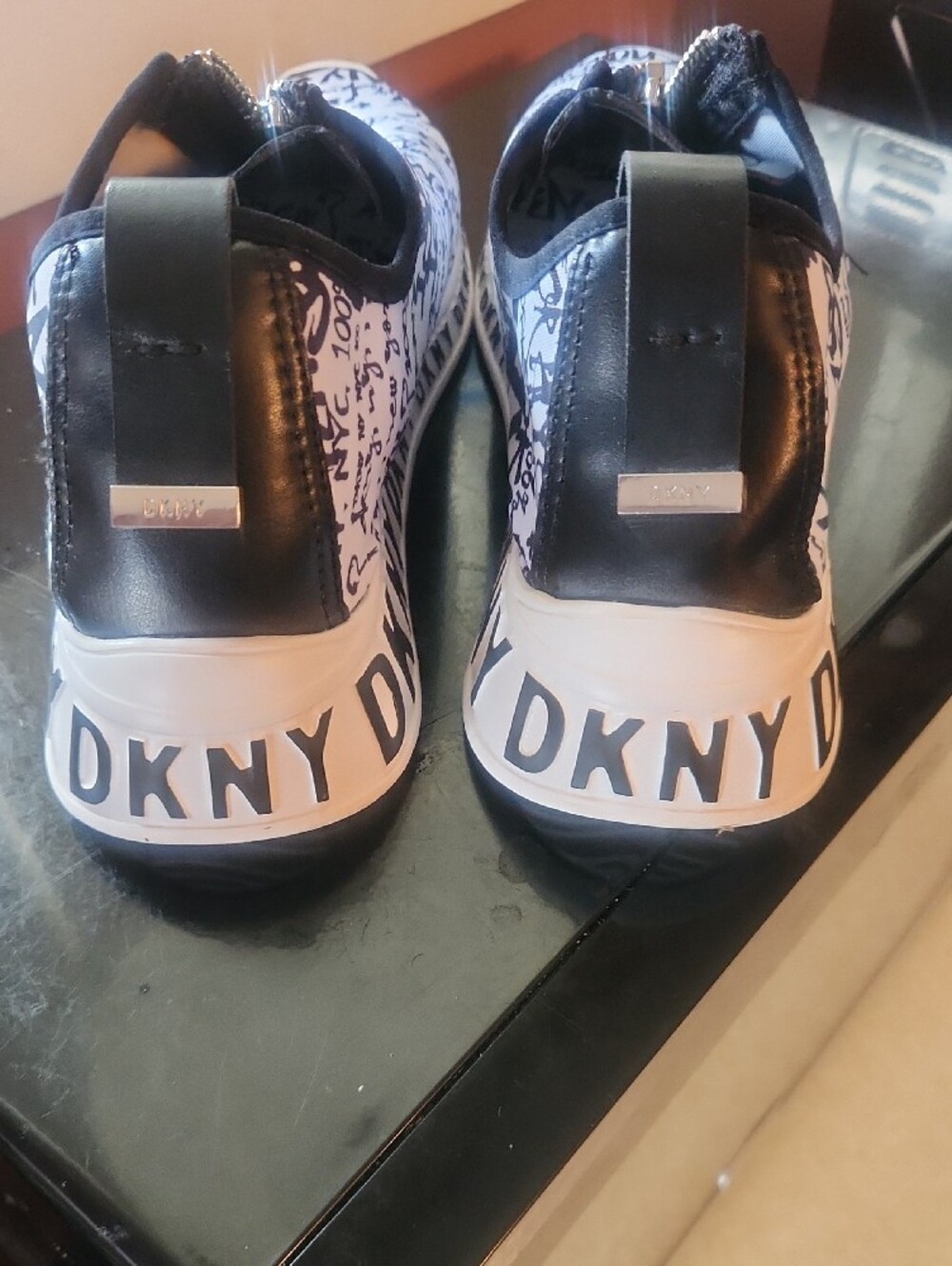 DKNY White and Black Graffiti Zip-Front Slip-On Sneakers with Branded Pull - Picture 5 of 5